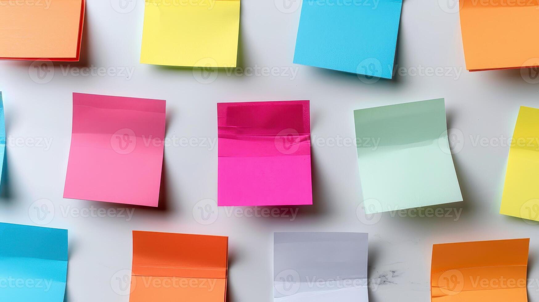 Colorful Sticky Notes Organized on a Bright Wall for Creative Ideas and Planning Activities photo
