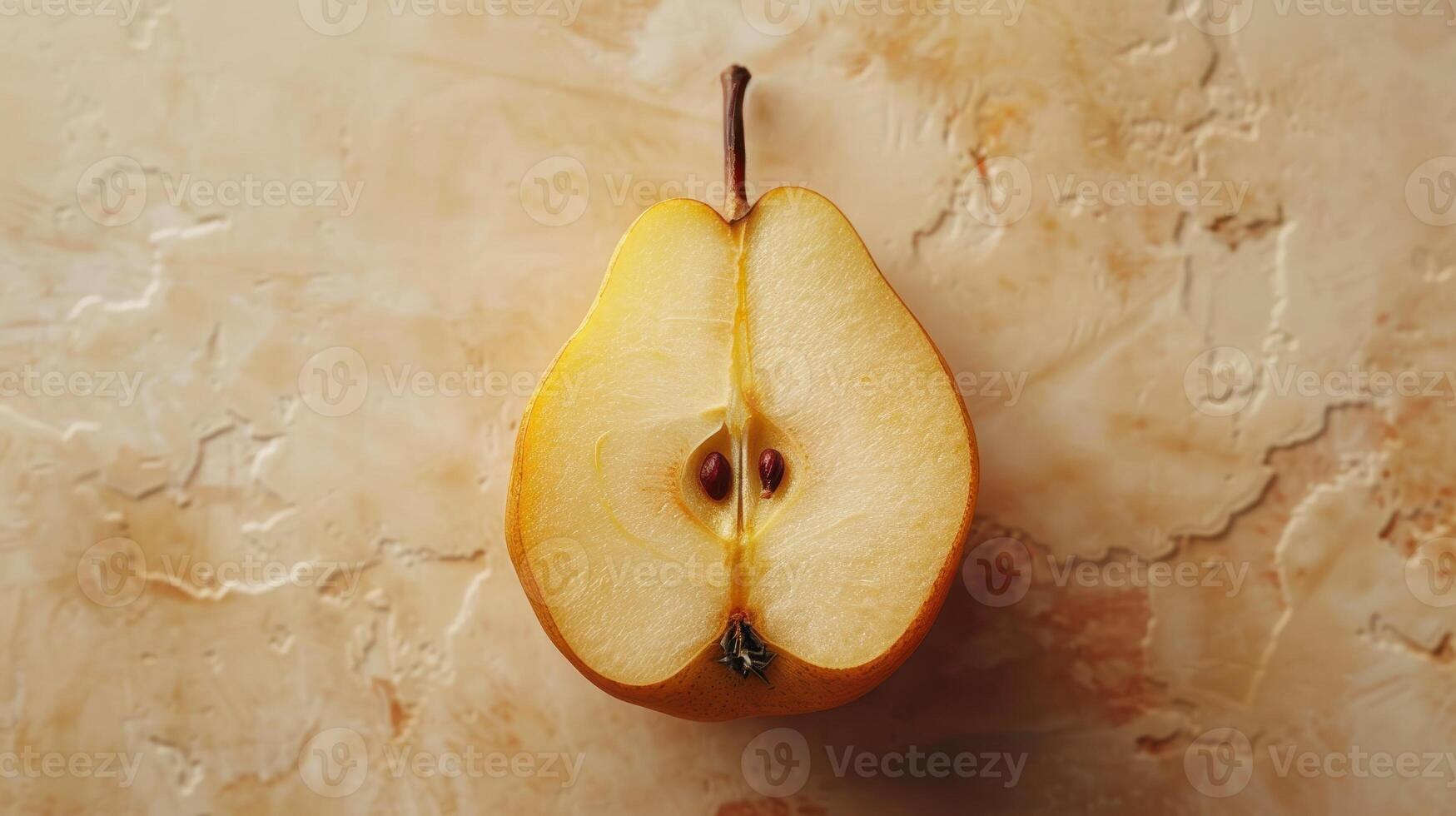A Perfectly Sliced Yellow Pear Sitting Gracefully on a Textured Beige Background Amid Soft Natural Light photo
