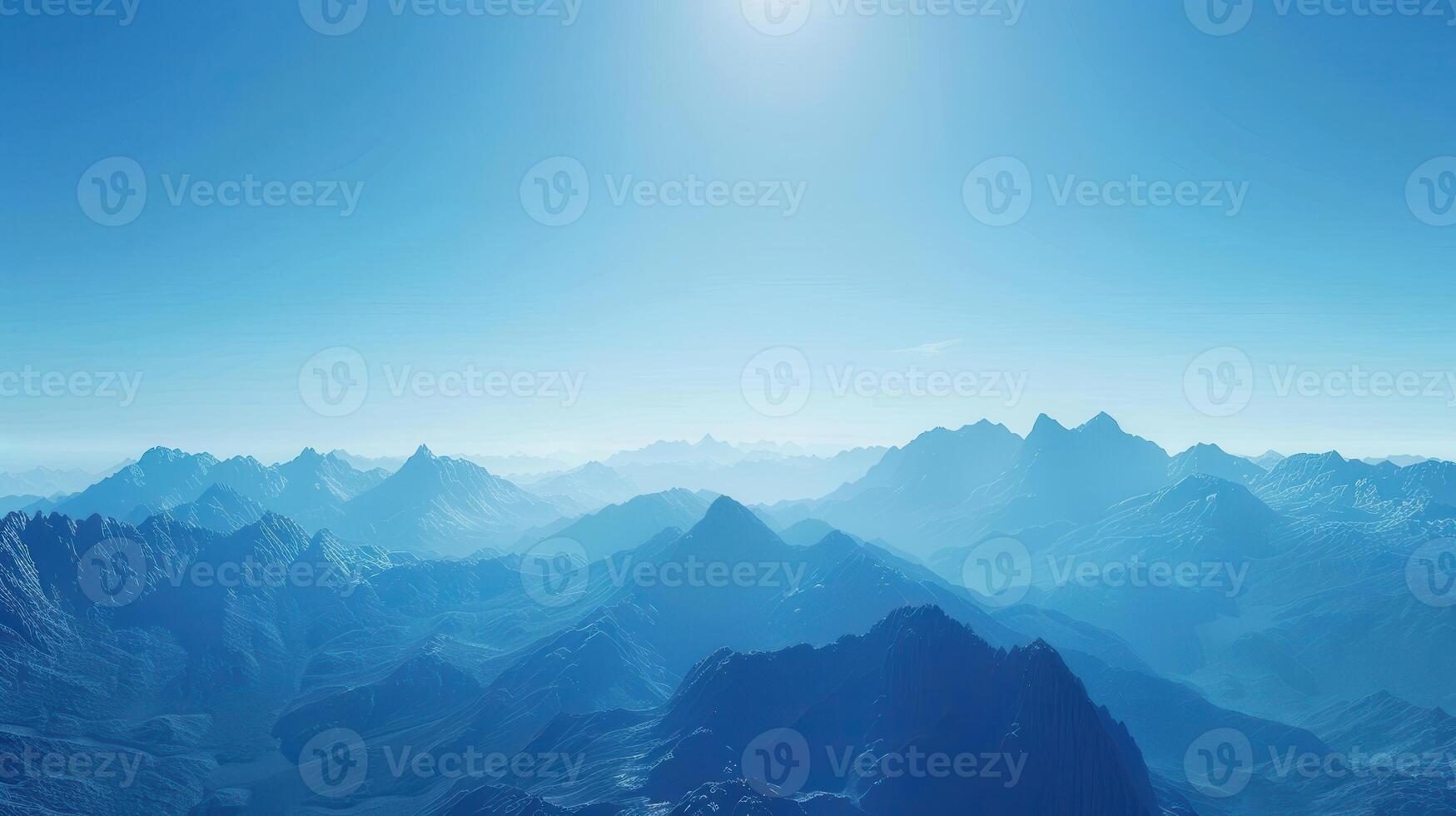 Majestic Mountain Range Under Clear Blue Sky During Serene Morning Light photo