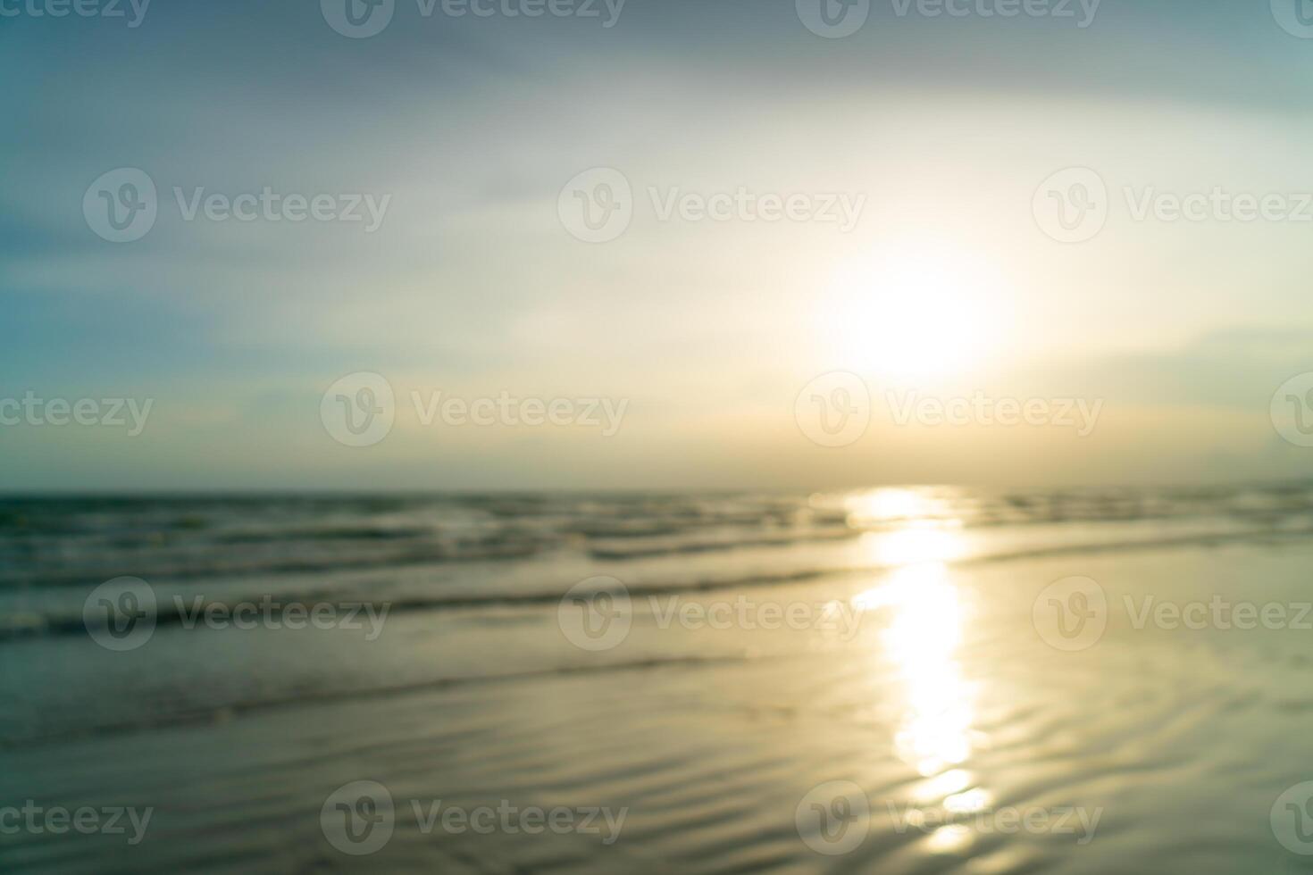 abstract blur beautiful sea beach with sunset time for background photo