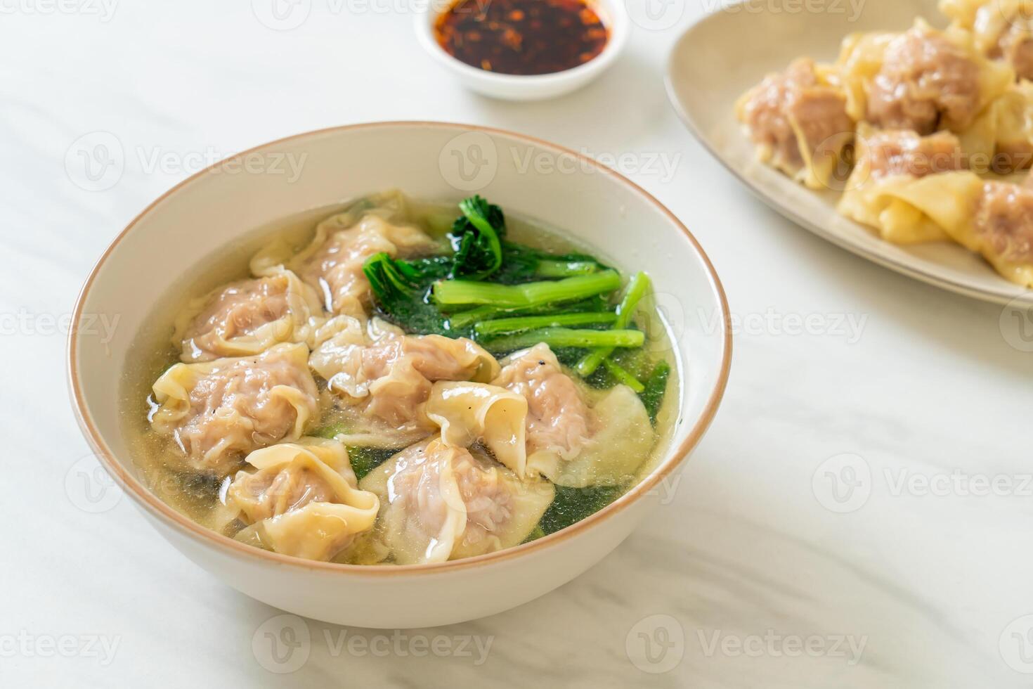 pork wonton soup or pork dumplings soup with vegetable photo