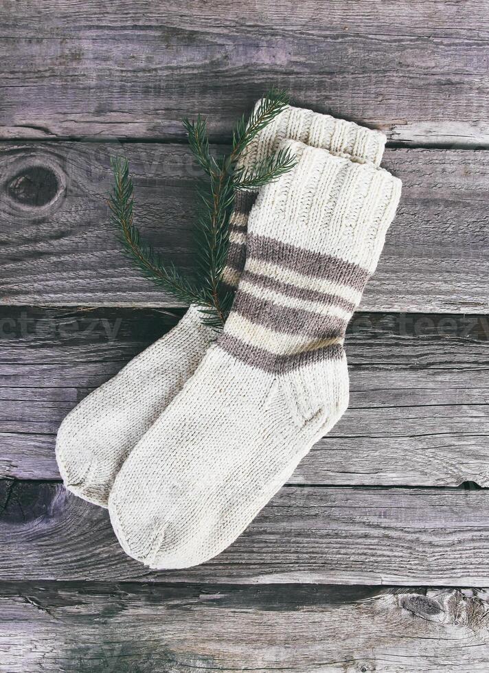 Handmade warm knitted socks of wool yarn photo