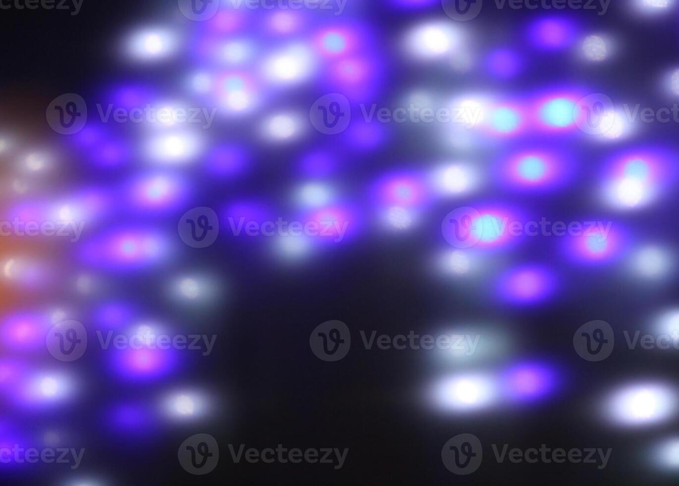 Christmas or New Year festivre blurred background with colorful garland lights photo