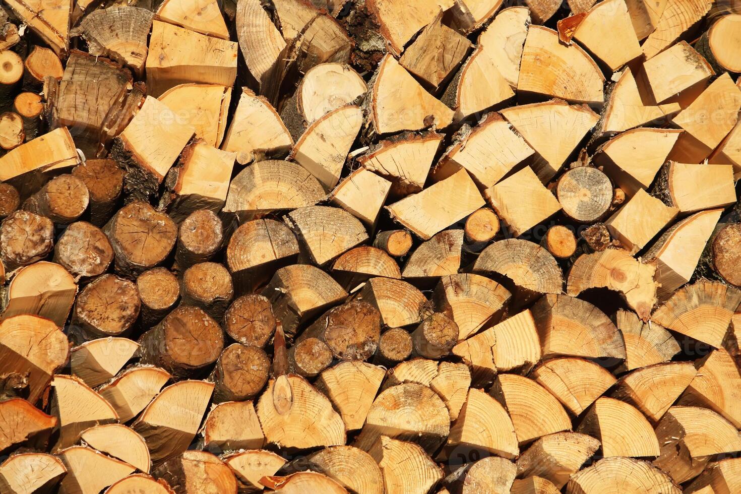 Chopped firewood on a stack photo