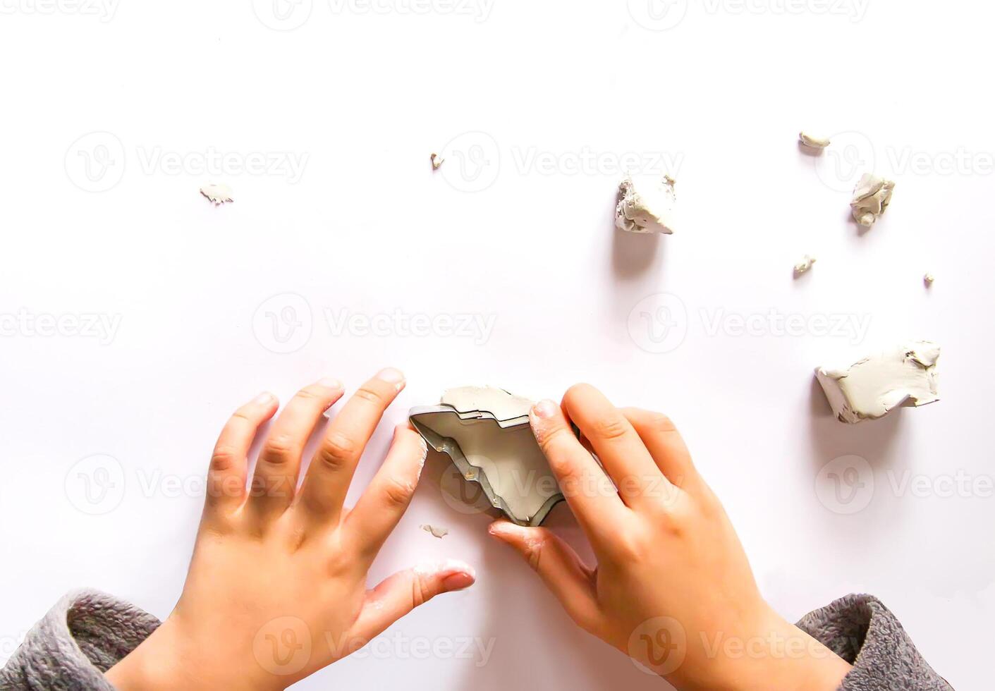 Figures creation from modeling clay. Creative activities in the process. Christmas and New Year handmade decor. photo