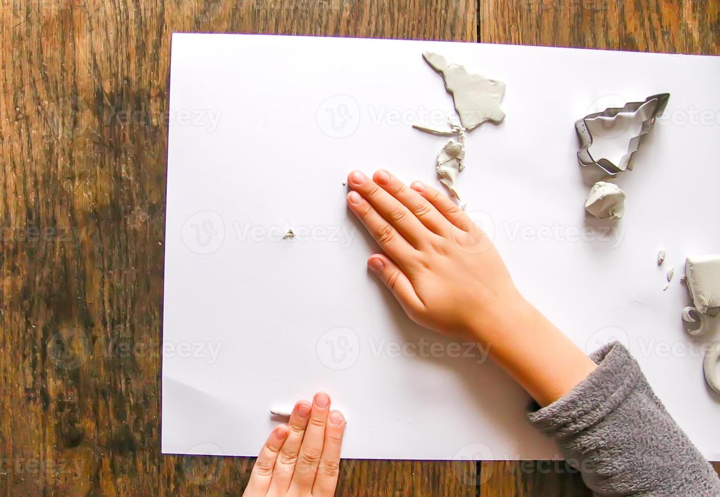 Figures creation from modeling clay. Creative activities in the process. Christmas and New Year handmade decor. photo