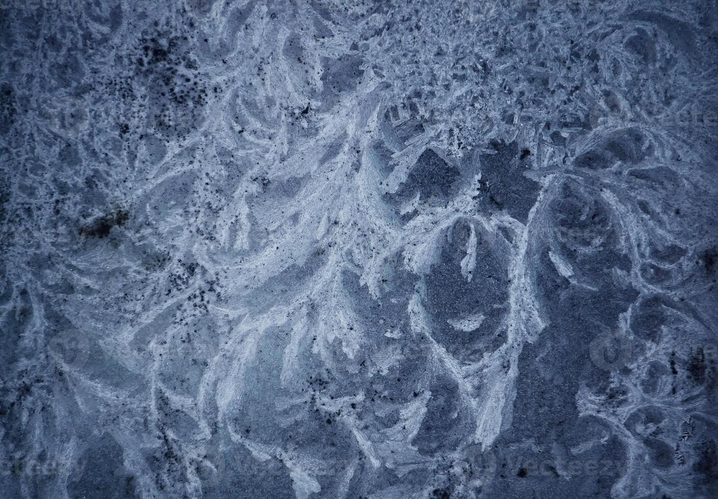Icy pattern on frozen window. photo