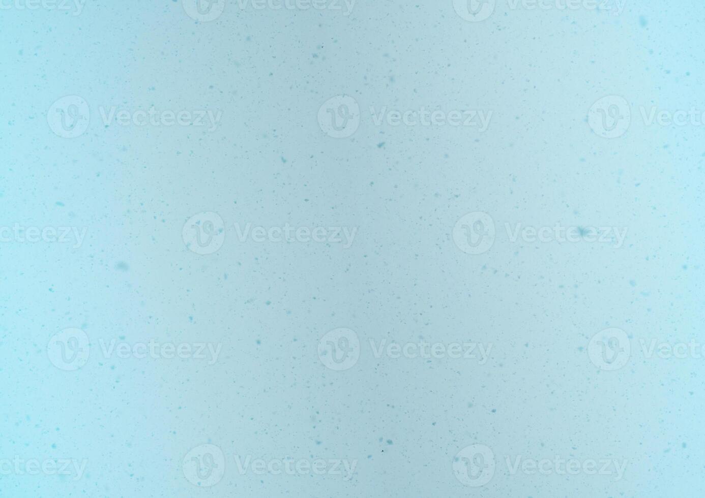 Blurred winter photo overlay. Empty space. Light background with fluffy flying snowflakes.