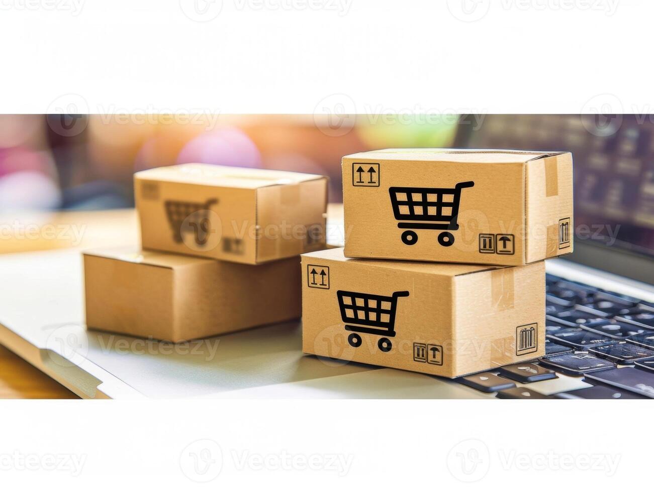 Cardboard boxes with shopping cart symbol representing online shopping concept photo