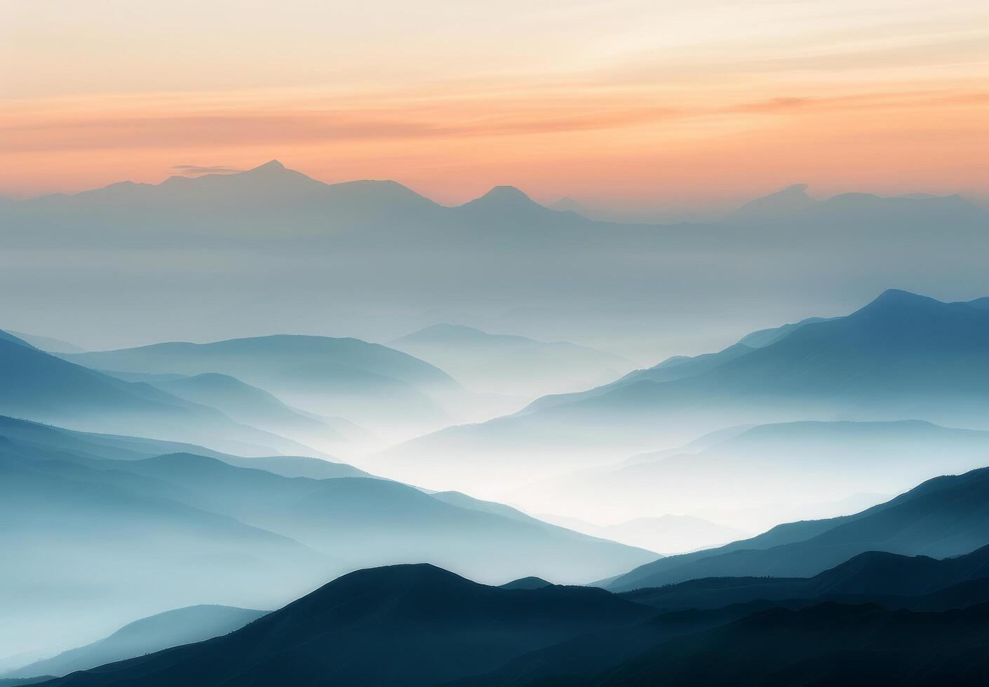 Serene Mountain Range at Dusk Overlooking Layered Blue Haze photo