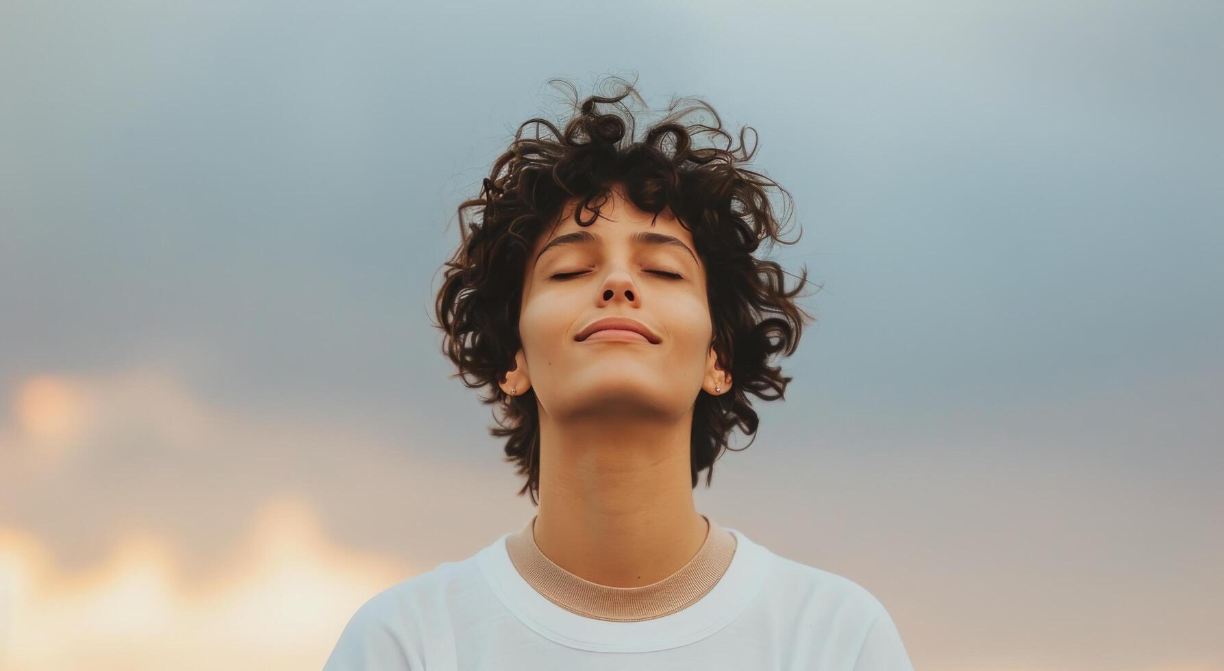 Woman With Curly Hair Meditating Outdoors photo