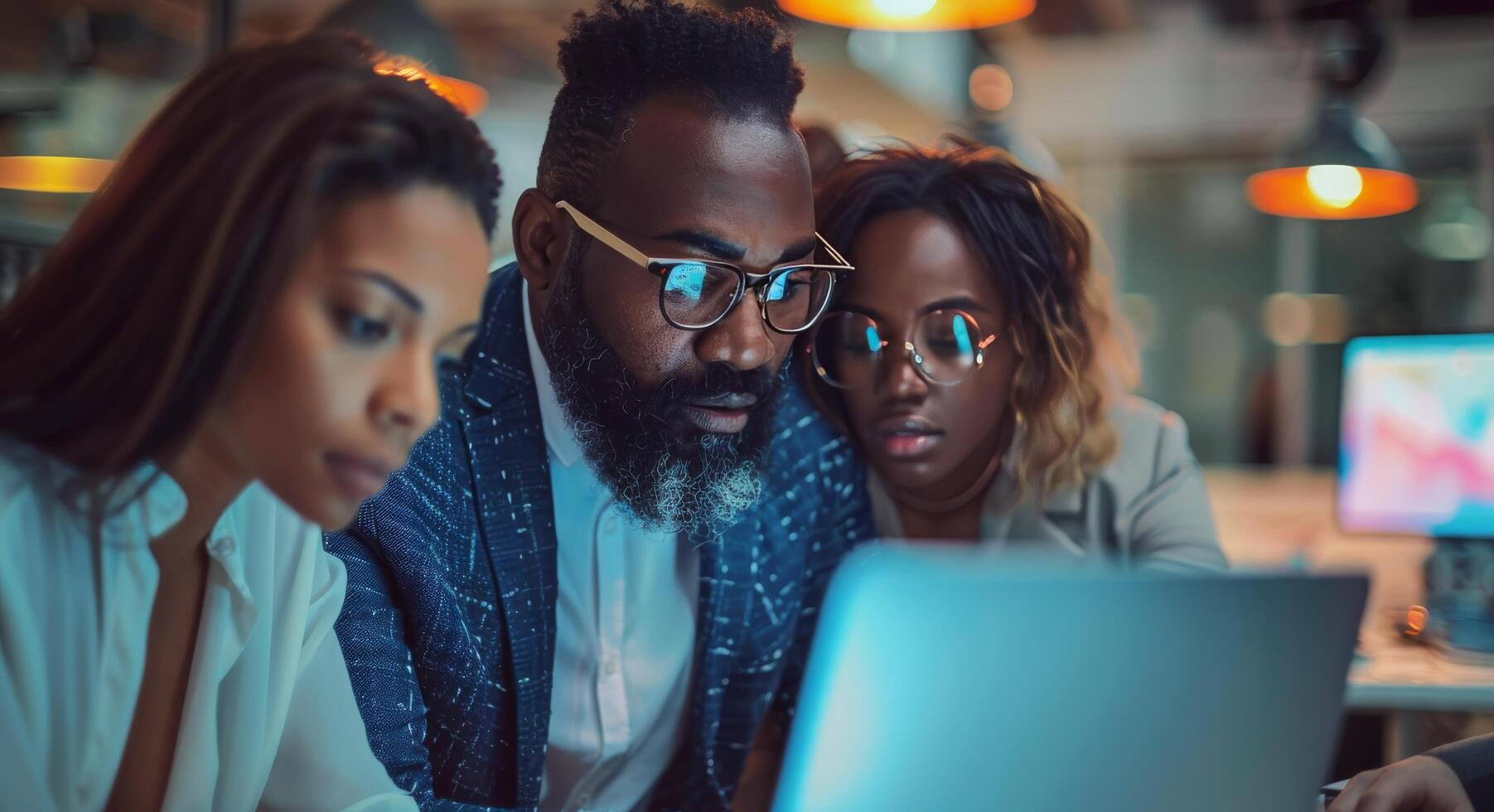 Diverse Team Working on Laptop in Modern Office photo
