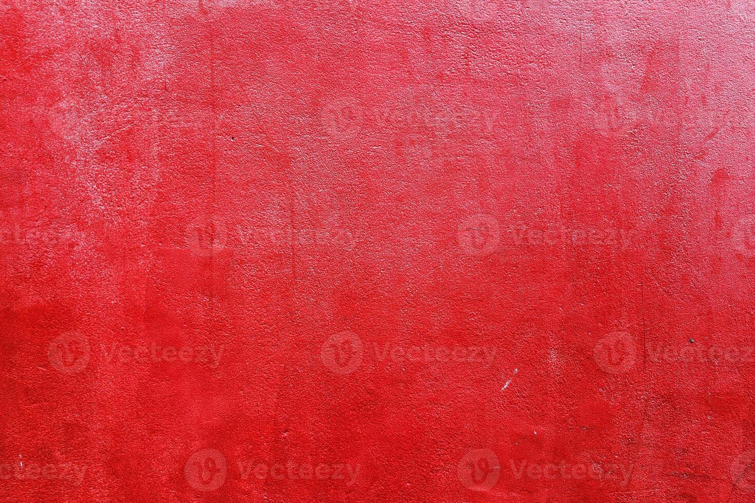 Red painting on grunge concrete wall background. photo