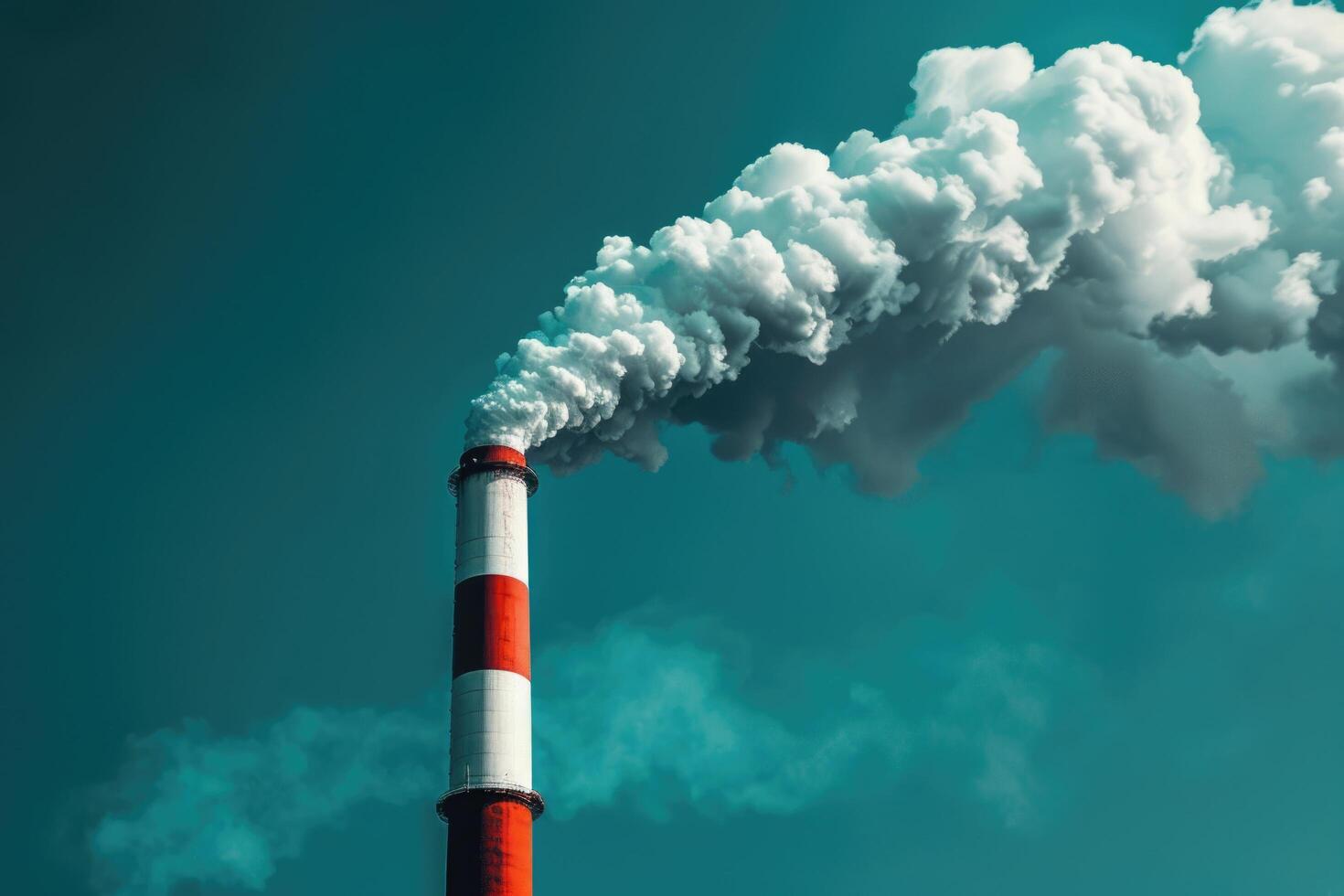 View on the smoke flue of the power plant against the blue sky, close up. photo