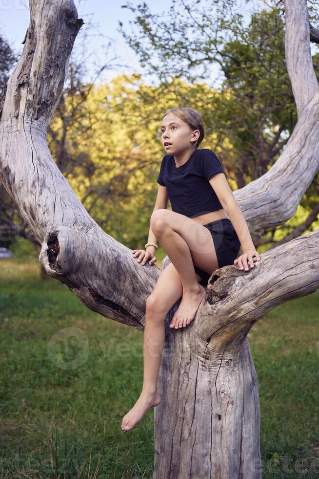 A 10-year-old gymnast practices in the garden photo