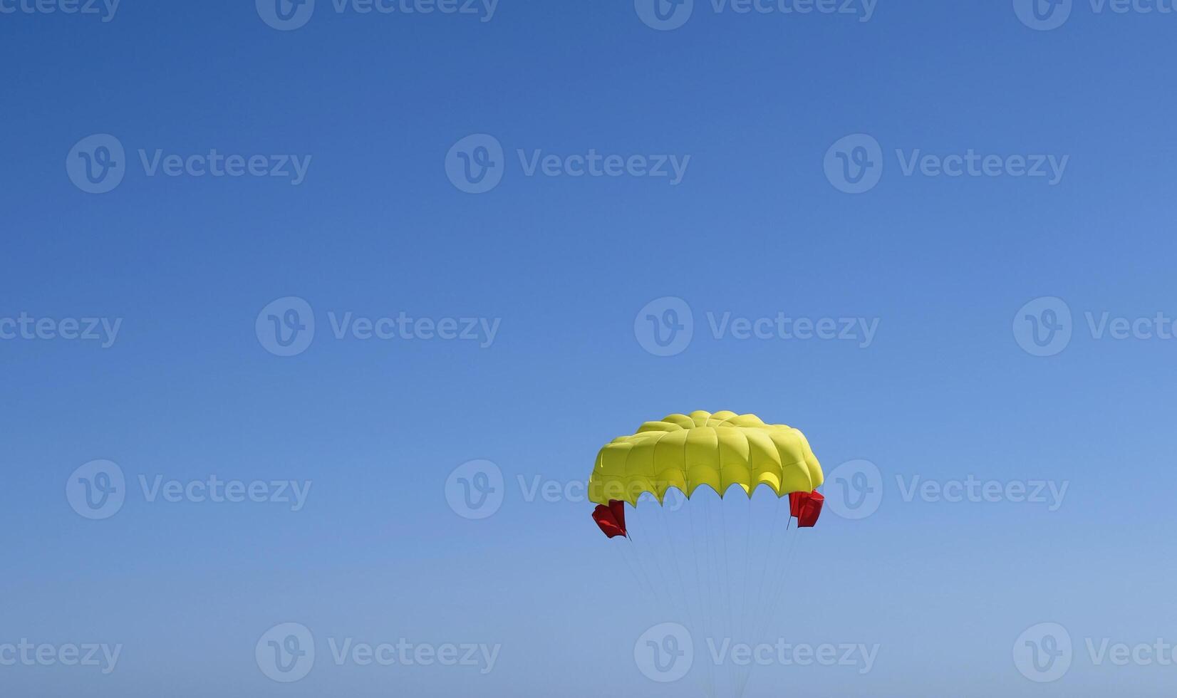 Gently sailing down with a parachute photo