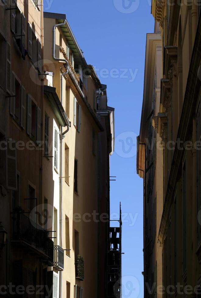 View up a narrow street in Nice, France photo