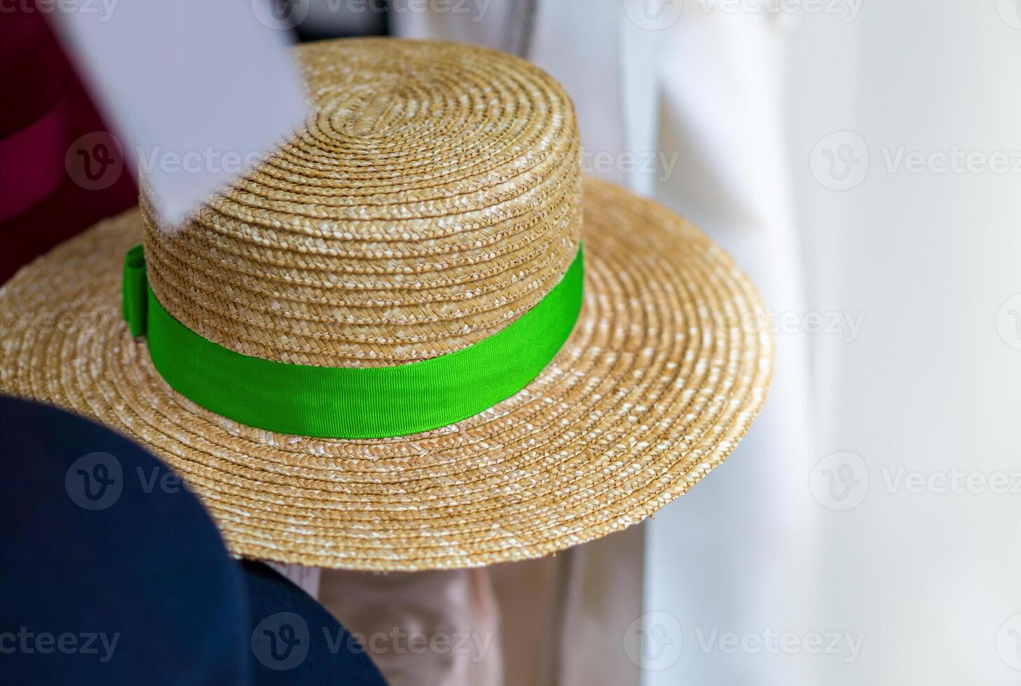 straw hat with green ribbon photo