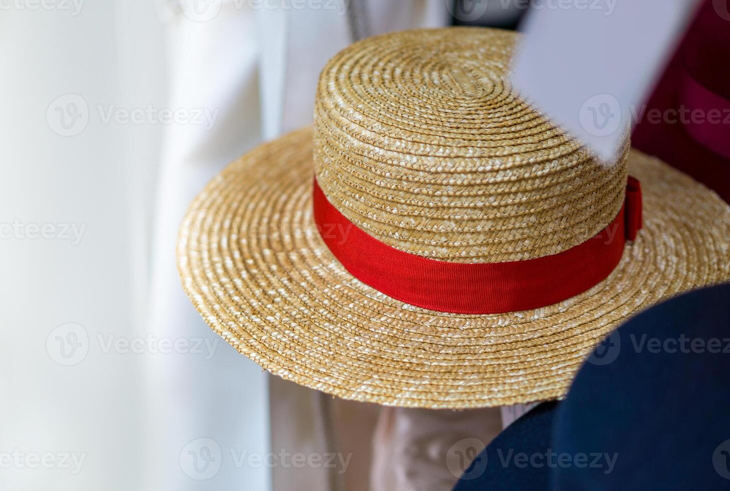 straw hat with red ribbon photo