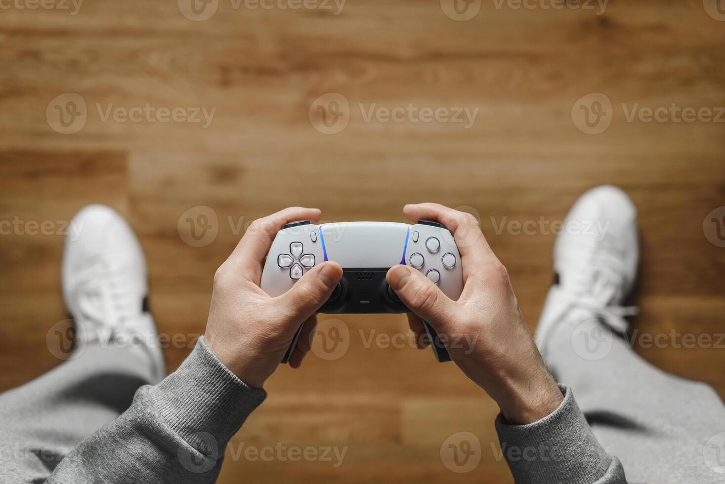 Hand hold new joystick. Gamer play game with gamepad controller. Gaming man holding simulator joypad. Person with keypad joystic in arms. happy to win. Gaming concept. photo