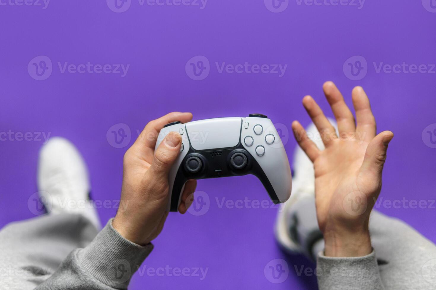 Hand hold new joystick isolated. Gamer play game with gamepad controller. Gaming man holding simulator joypad. Person with keypad joystic in arms. not understanding the situation. Gaming concept. photo