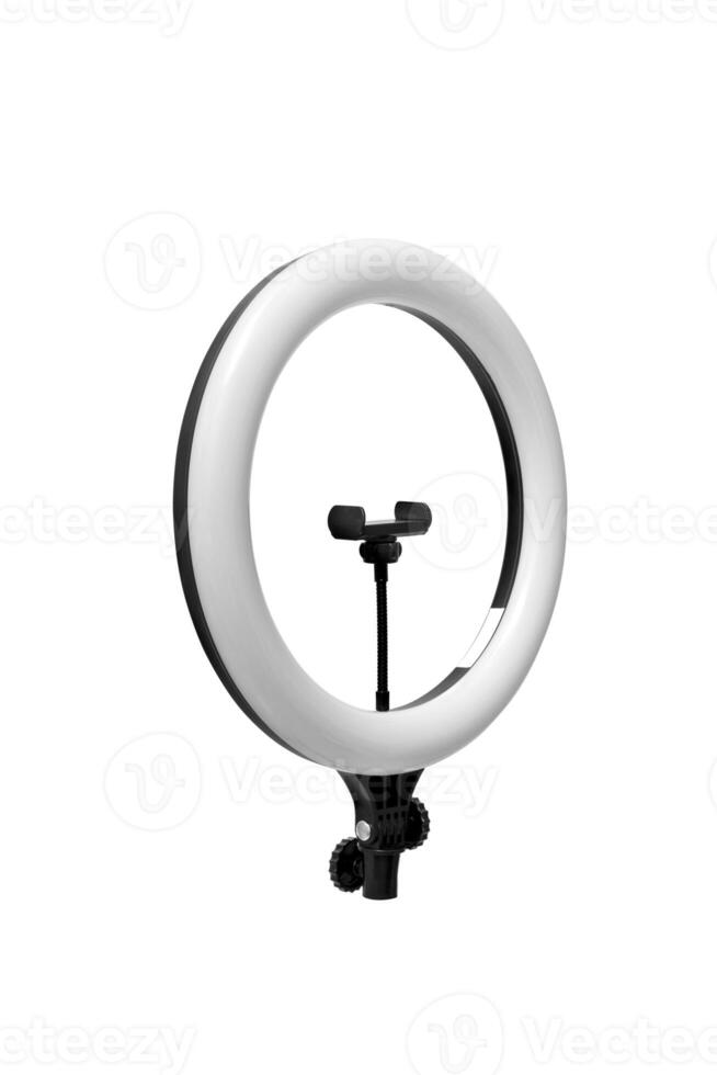 Closeup of circular neon LED lamp isolated white background. Popular modern light for make-up and beauty portraits. photo