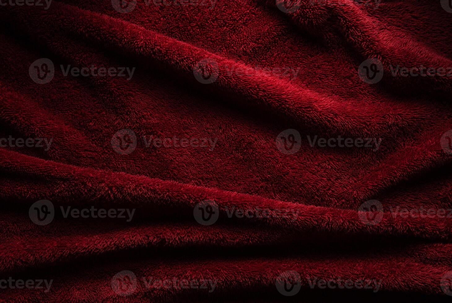 A soft red terry towel. Burgundy texture back. Underlay and free space for text. photo