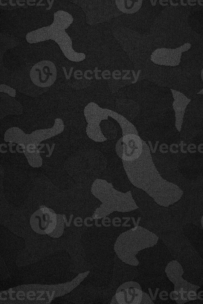 Camouflage pattern. Trendy dark gray camouflage fabric. Military texture. Dark back. photo