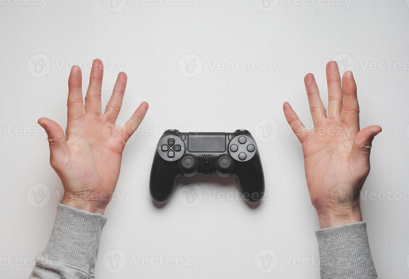 Hand hold new joystick isolated. Gamer play game with gamepad controller. Gaming man holding simulator joypad. Person with keypad joystic in arms. Sleeve hands hold toy equipment. Modern manipulator. photo
