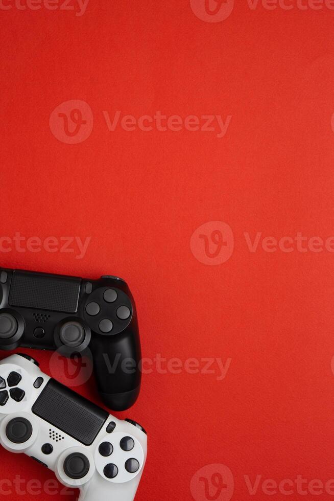 black and white gamepads on a red. Gaming concept photo