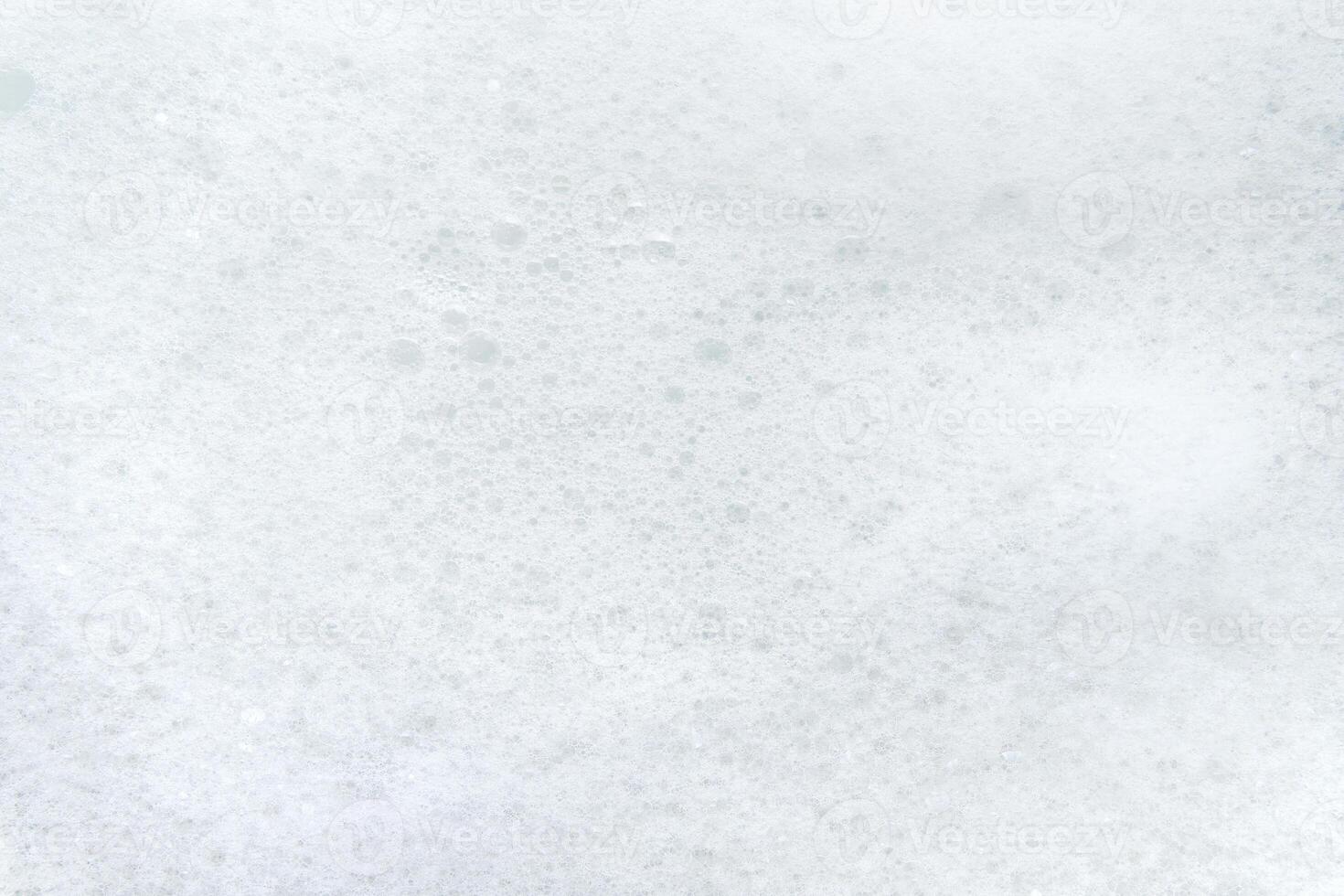White soap suds. Back from small soap bubbles. photo