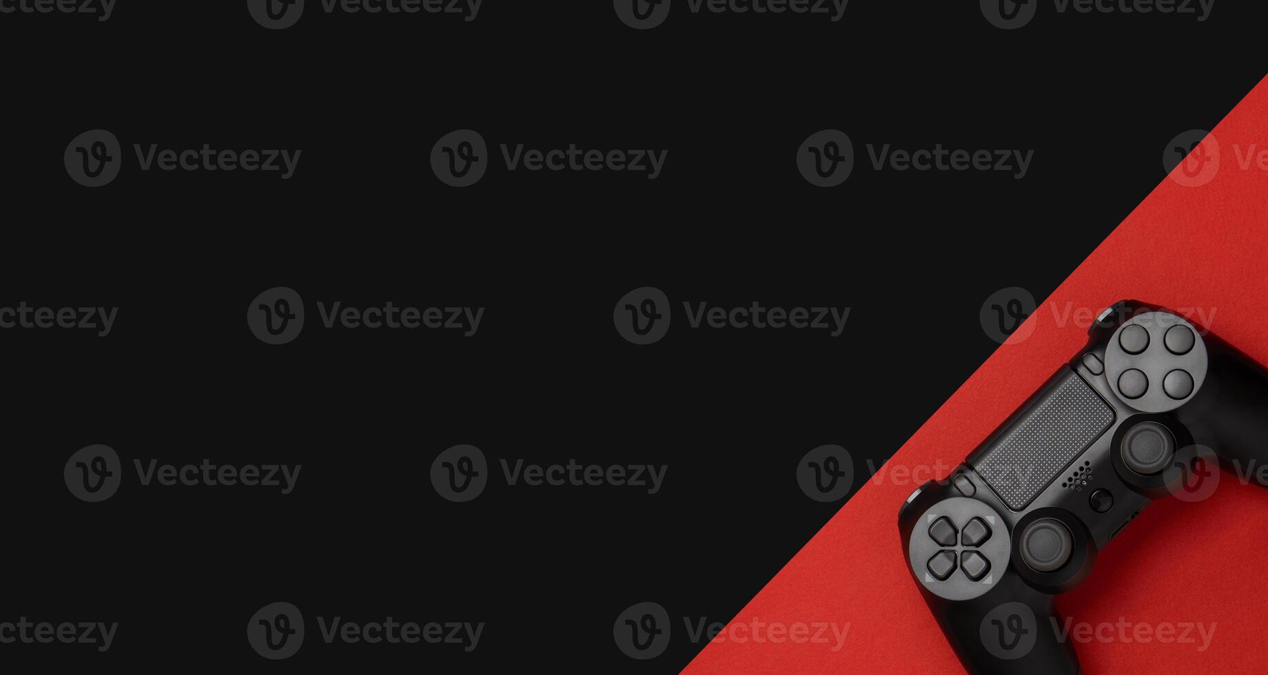 black gamepad on a black red. Gaming concept photo