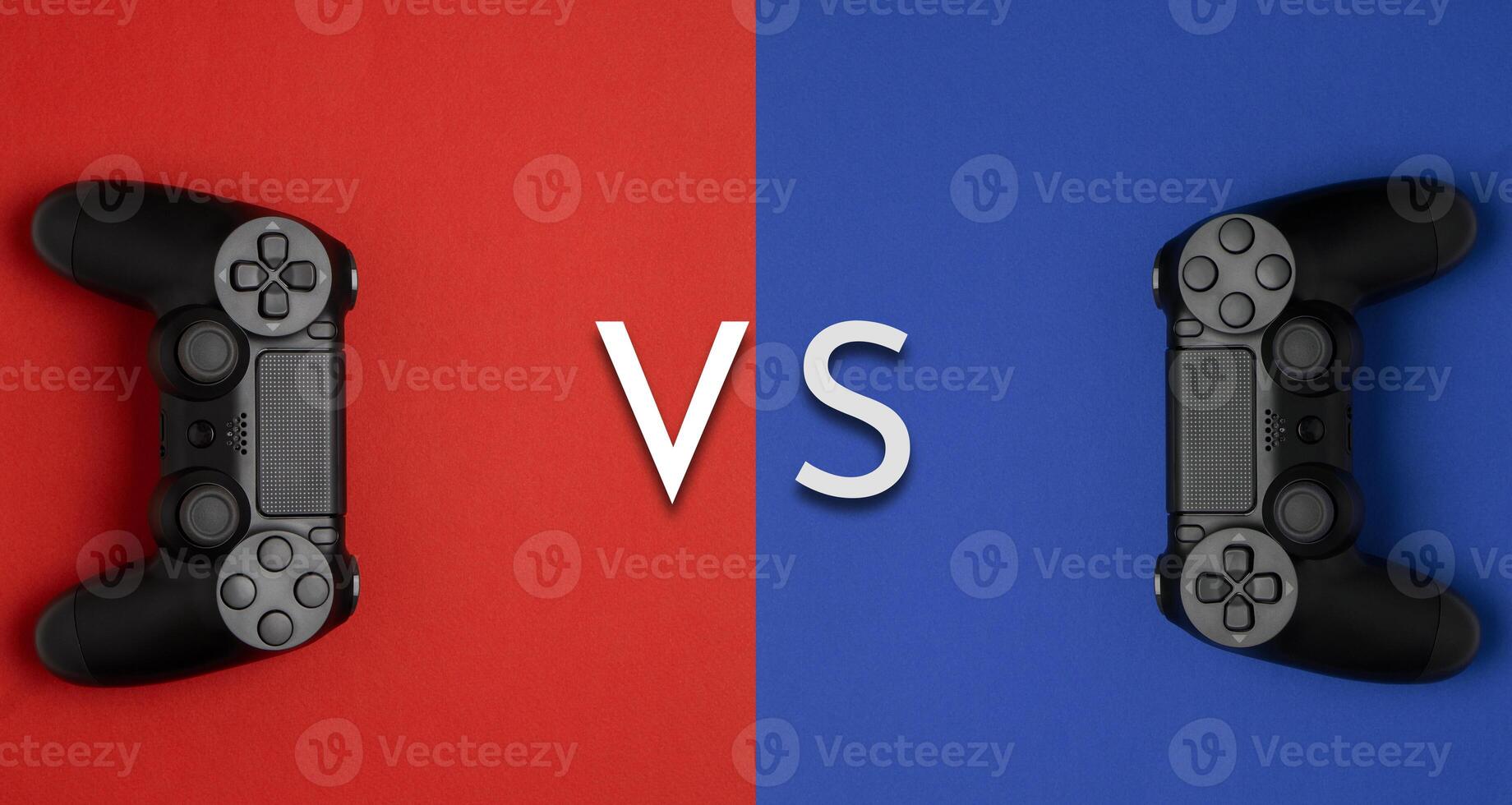 black gamepads on a red blue background. Gaming concept. Player versus plauer. Player vs player. photo