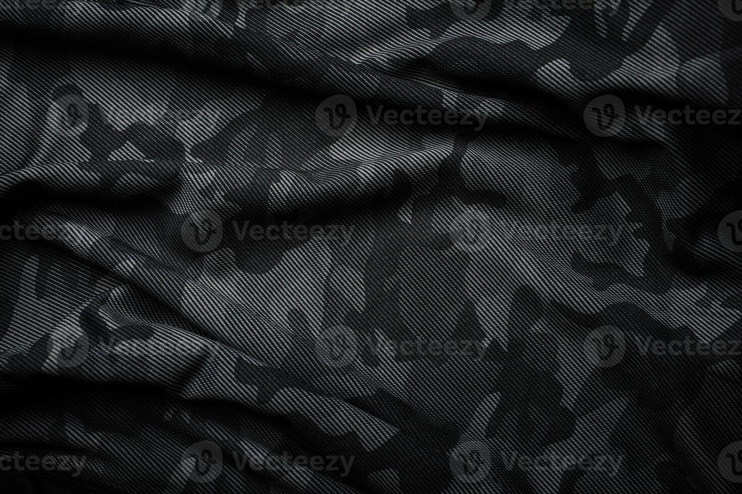 Camouflage pattern. Trendy dark gray camouflage fabric. Military texture. Dark back. photo