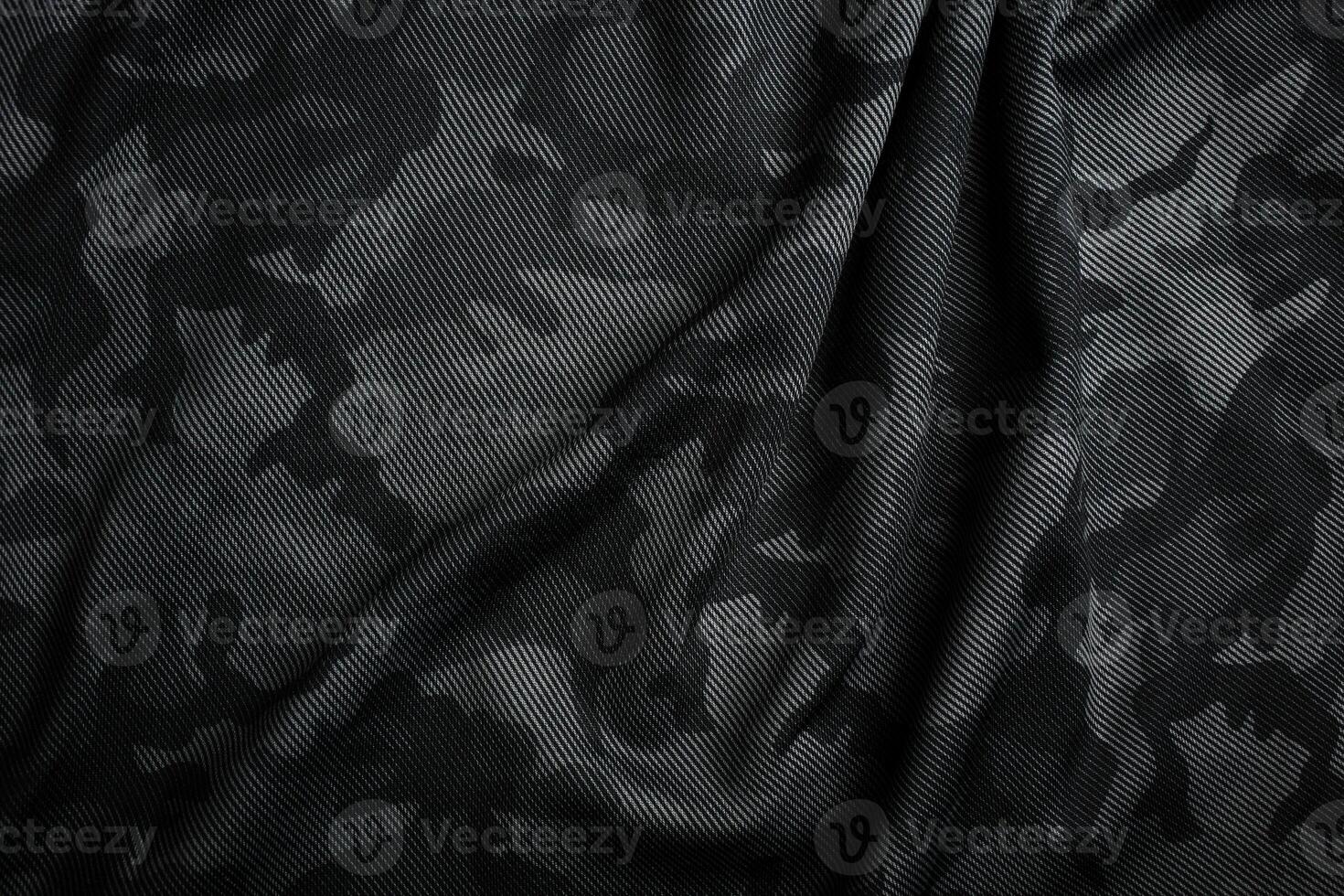 Camouflage pattern. Trendy dark gray camouflage fabric. Military texture. Dark back. photo