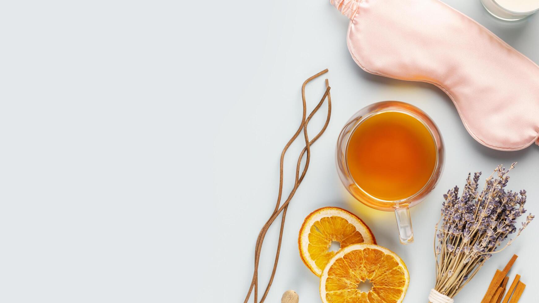 Healthy sleep flat lay with mask, lavender and herbal tea photo