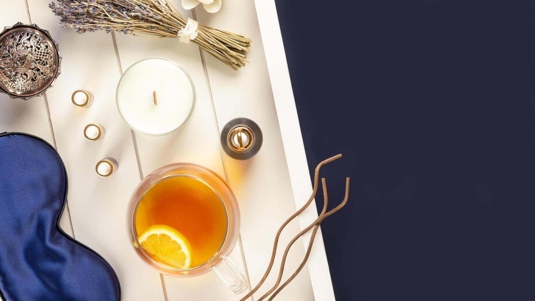 Healthy sleep flat lay with sleeping mask, lavender, candle, copy space photo