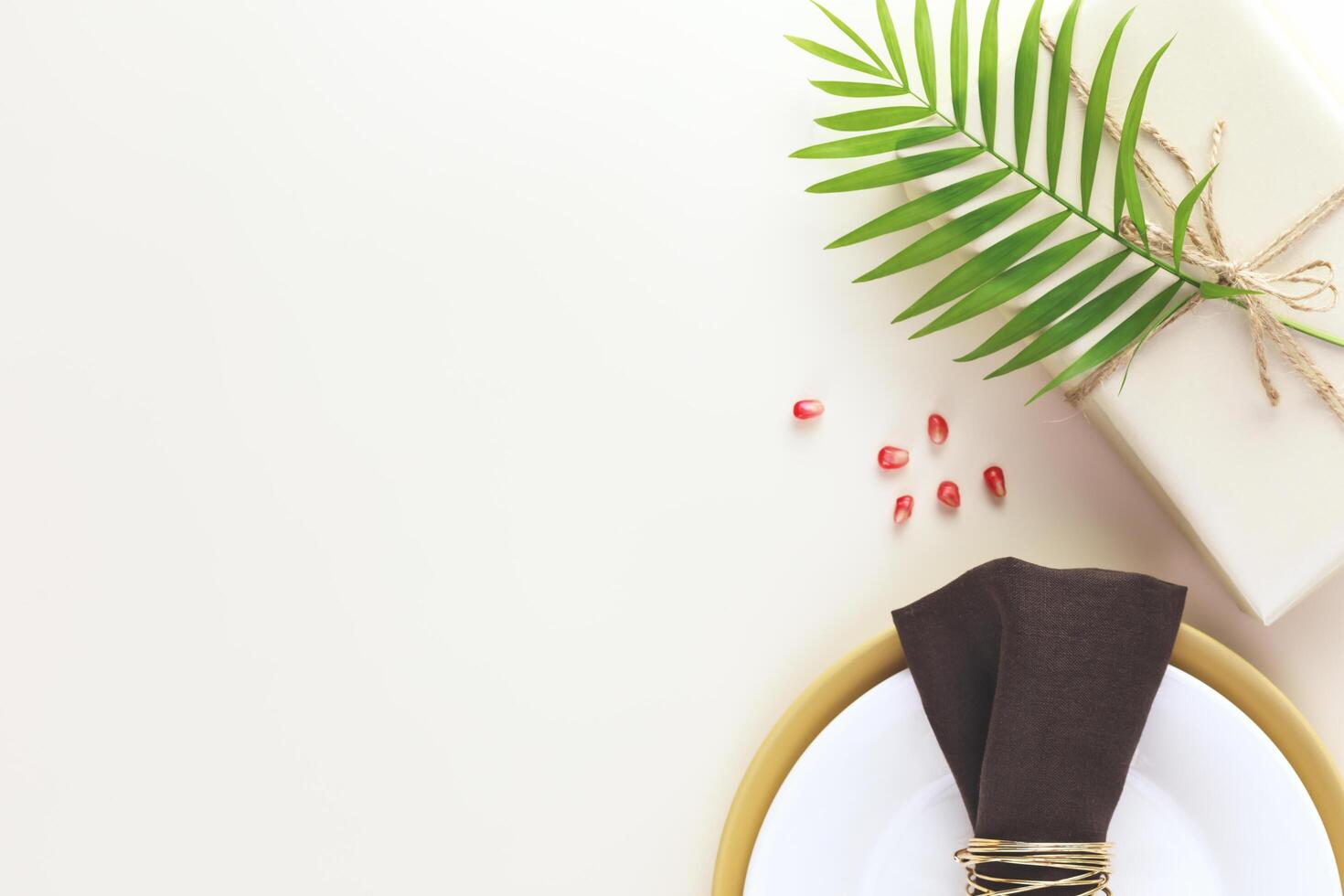 Holiday background with present with palm leaf, table settings photo