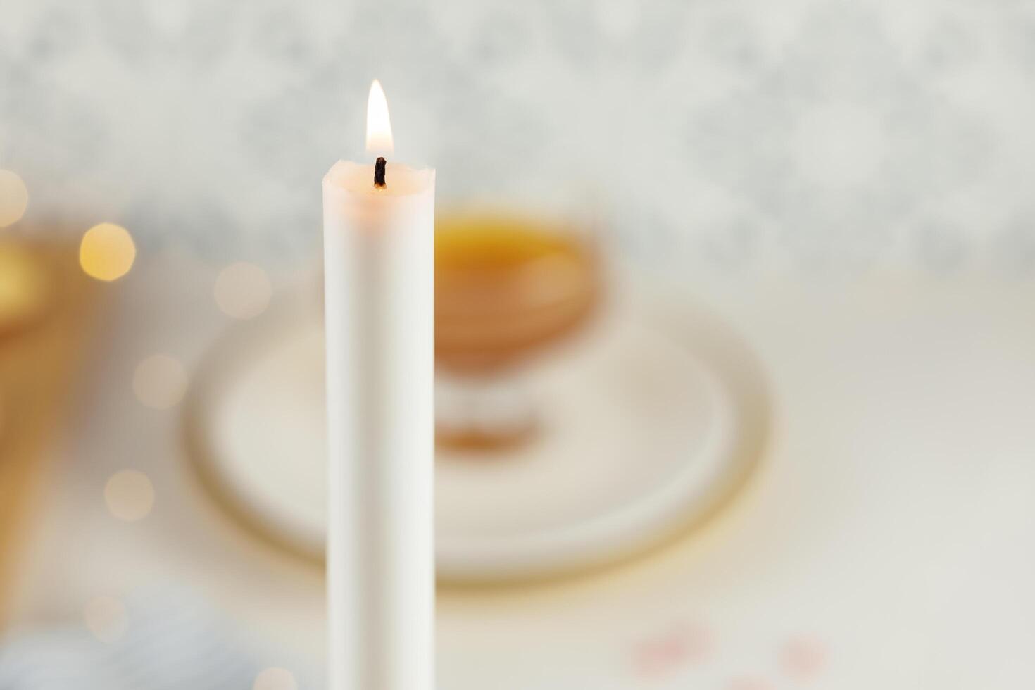 Rosh hashanah comnposition with a burning white candle photo