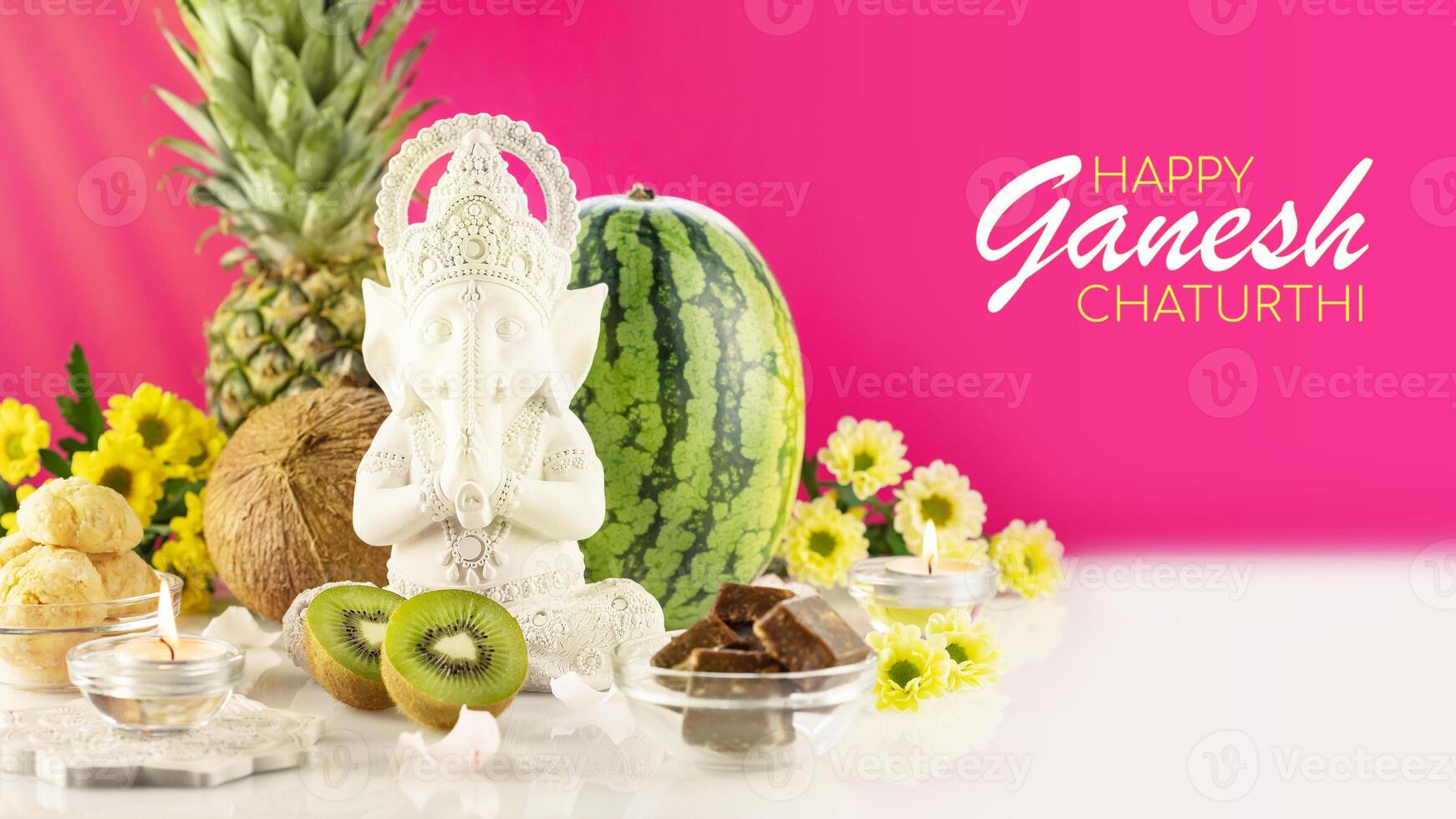 Holiday card with culpture of Ganesha, offerings, fruits and sweets photo