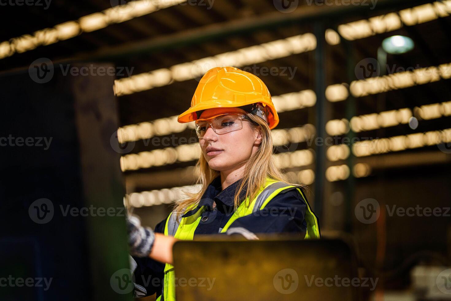 people with machinery equipment plant technology. smart industry worker operating. Factory engineer woman standing confident to control panel switch. Worker works at heavy machine at industry factory. photo