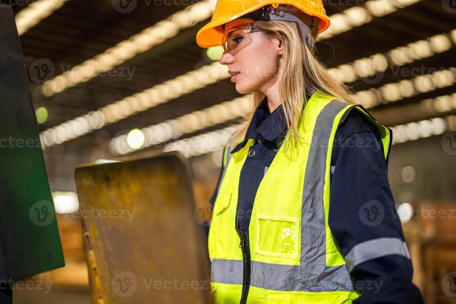 people with machinery equipment plant technology. smart industry worker operating. Factory engineer woman standing confident to control panel switch. Worker works at heavy machine at industry factory. photo