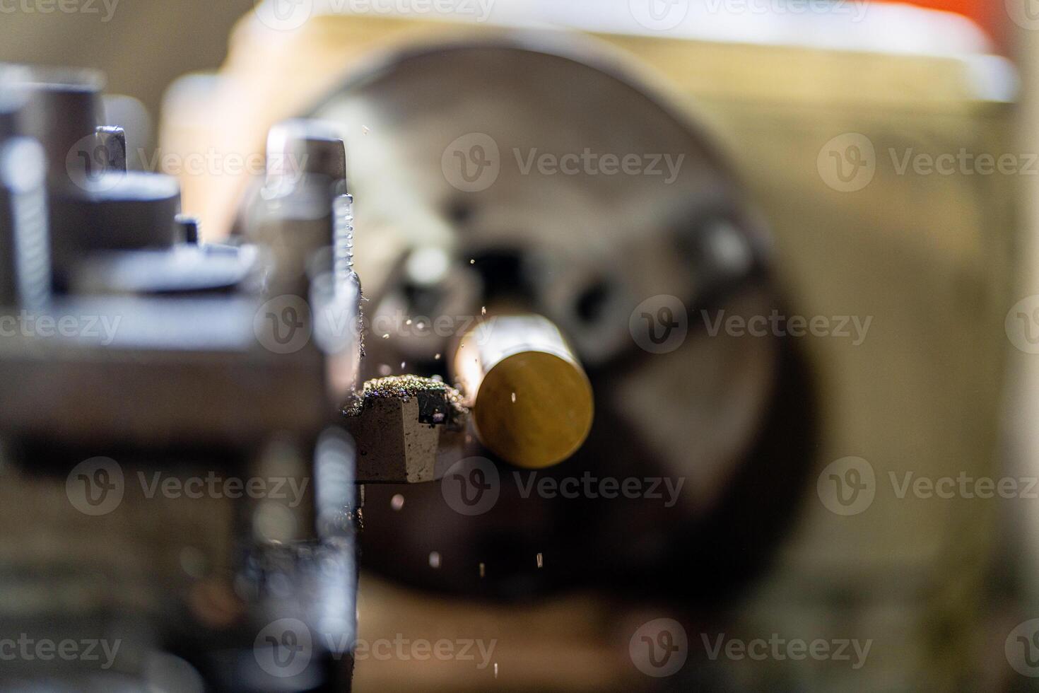 close up of machine operation for Metal Lathes. The steel column rolling in machine. metalworking industry. finishing metal working internal steel surface on lathe grinder machine with flying sparks photo
