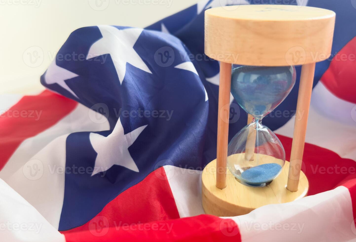 USA red white and blue flag with hour glass showing time is running out for democracy freedom and the American way photo