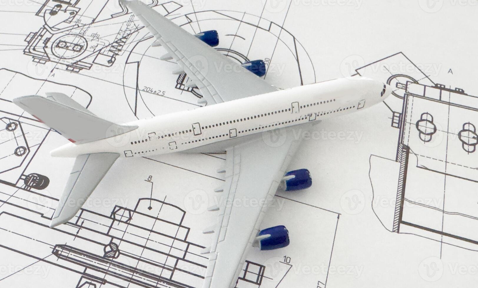 Image of passenger airplane and engineering blueprint photo