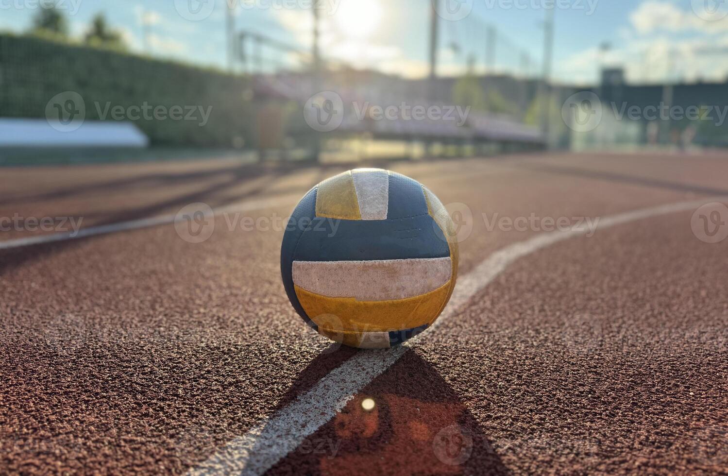 volleyball. blue with yellow color ball on the playground. volleyball cover, red. ball game photo