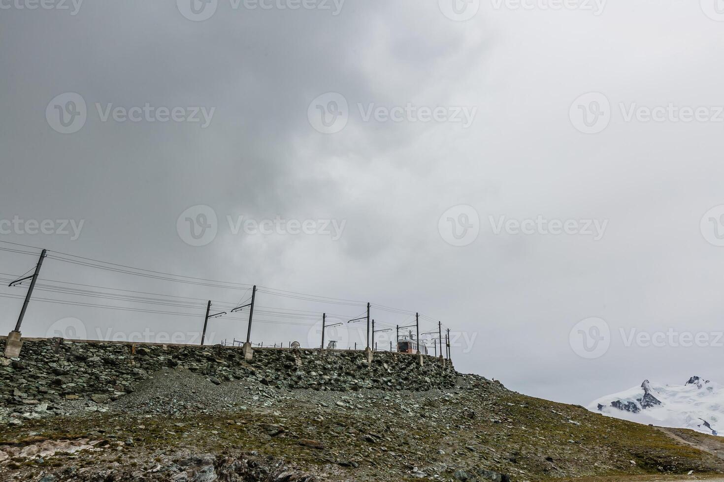 Panorama of cloud layer from mountain top over Swiss alps photo