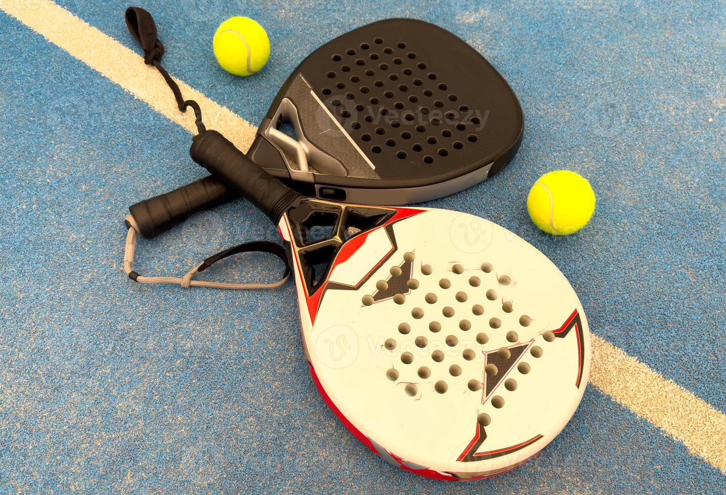 paddle rackets on the playing court photo