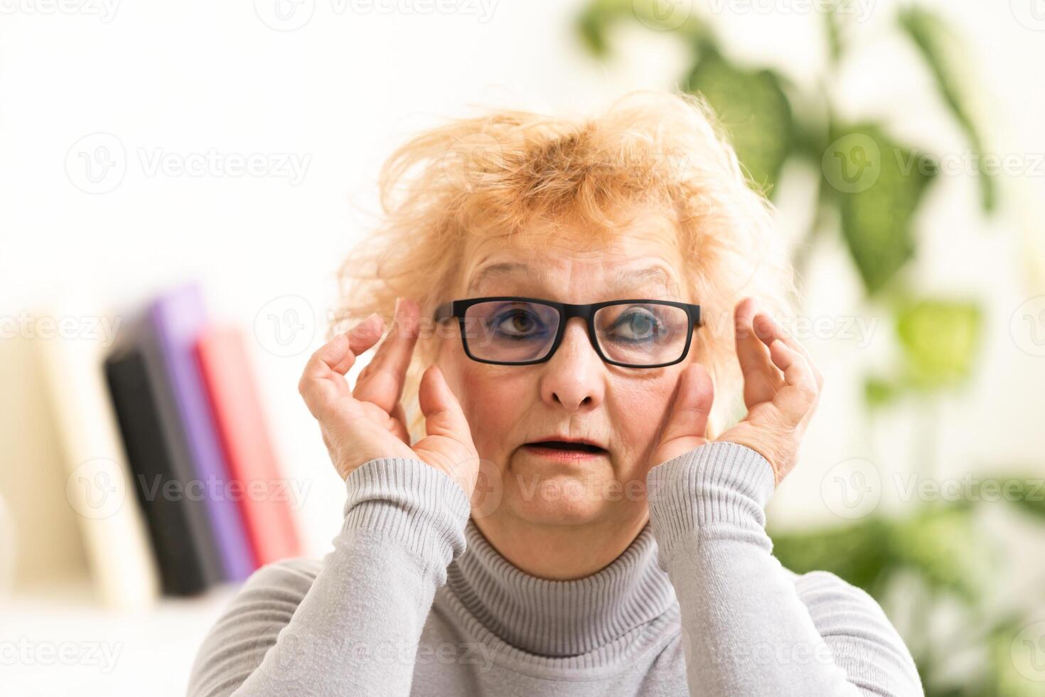 Head shot mature woman looking at camera and talking, grandmother chatting with relative online, making call, middle aged blogger recording vlog, teacher speaking to webcam, distance lecture photo