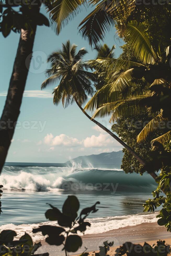 Close-up image of powerful high ocean waves on the background of a tropical island with palm trees and exotic plants photo